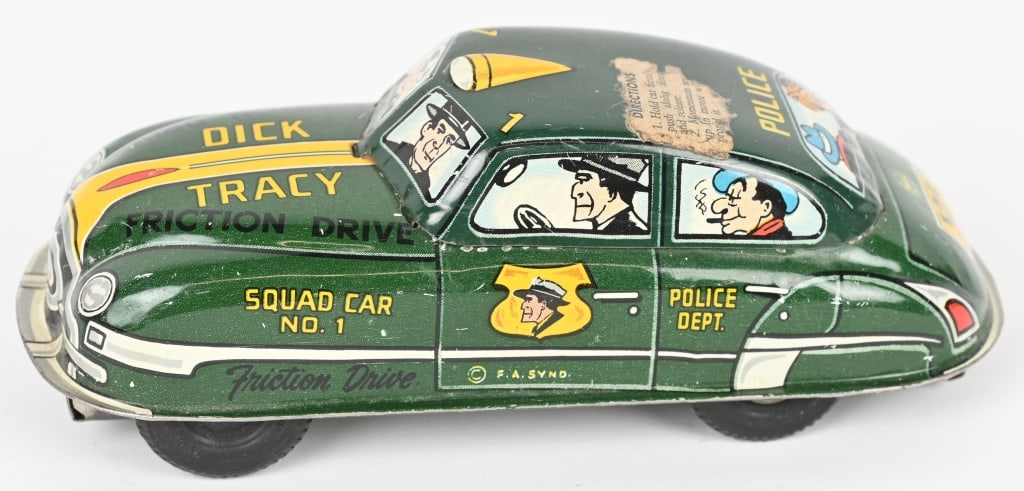 MARX TIN FRICTION DICK TRACY CAR: Very nice all original Dick Tracy Squad car with original paper instructions still on the roof. Friction works. 6 1/2" Excellent
