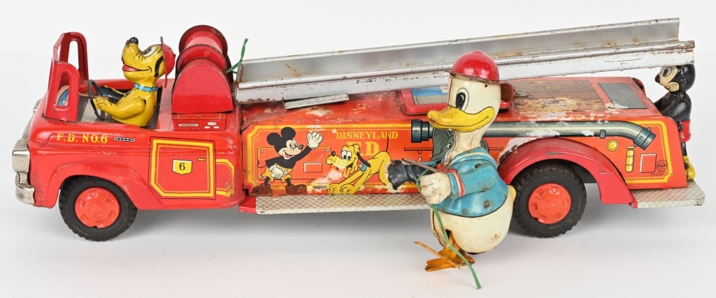 LINEMAR CLIMBING DONALD DUCK FIRE TRUCK: Very desirable Walt Disney tin toy. All original condition. Still has climbing Donald Duck. Mickey Mouse on back, and Pluto driver. Fire truck has great colors and Disney Character graphics. Friction