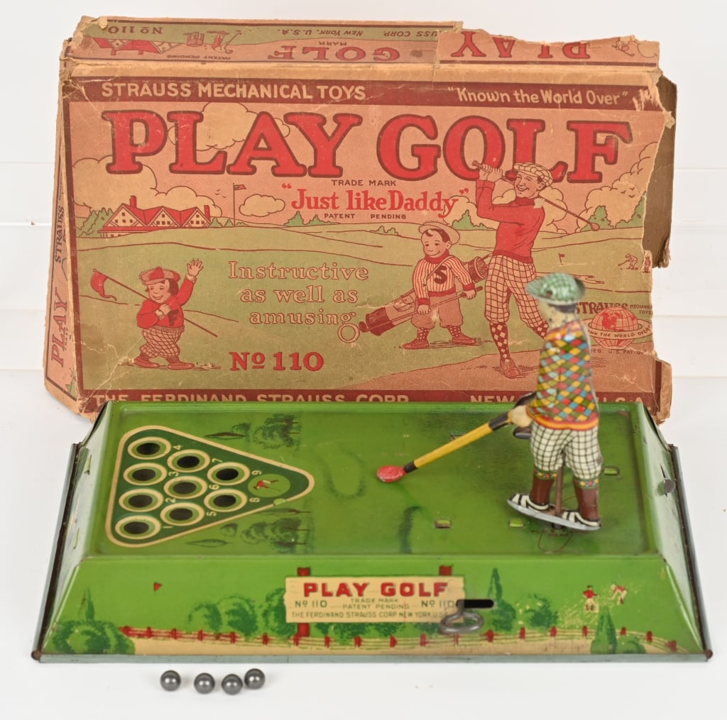 STRAUSS TIN WINDUP PLAY GOLF w/ BOX: The toy is all original with great colors and gloss. Worked fine when tested and includes 4 original balls. Original graphic box has wear and detached end flaps. Base is 12" by 7". Excellent