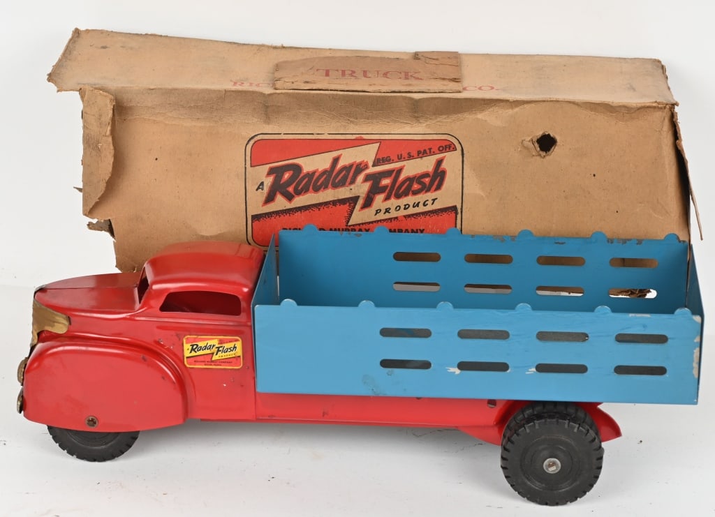 RADAR FLASH PRESSED STEEL STAKE BED TRUCK w/ BOX: All original but there is some surface rust on the grill. Condition should clean up to a higher grade. Box is a little rough. 20" Very Good- Excellent