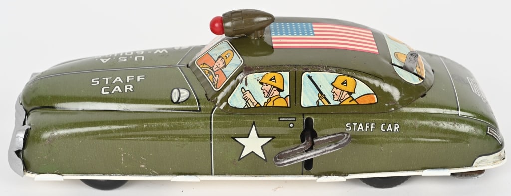 MARX TIN WINDUP STAFF CAR: Has nice graphics. Has electric light on roof. Windup works. Base is repainted. 11" Excellent