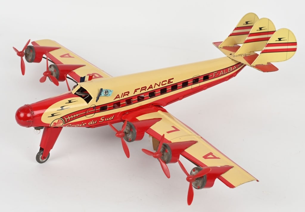 JOUSTRA TIN WINDUP AIR FRANCE AIRPLANE: great looking 6 prop Airplane. All original and complete with nice colors. Windup needs adjustment. 24" Wingspan. Excellent