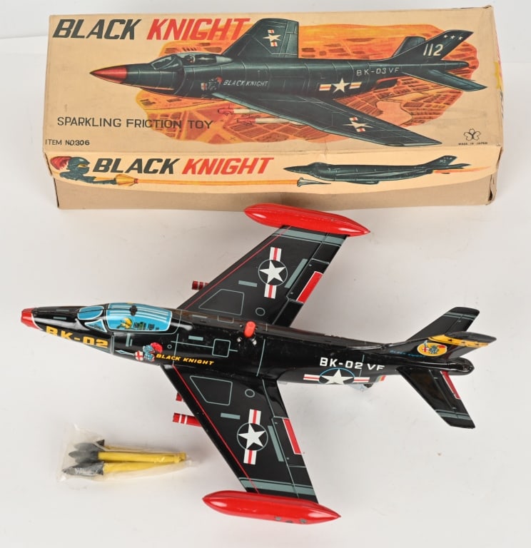JAPAN TIN FRICTION BLACK KNIGHT JET FIGHTER: All original with great design and details. Friction works. Has some spidering to litho. Boxed 14" Excellent