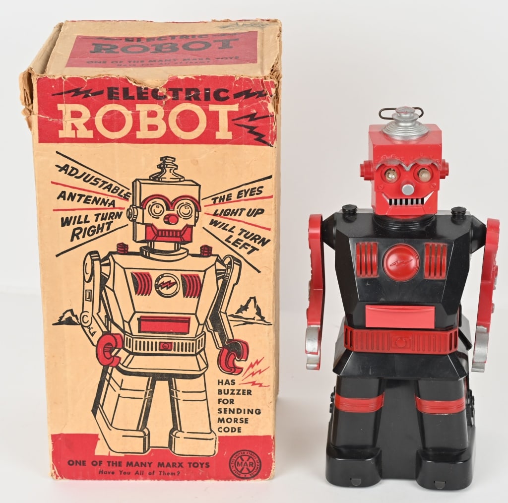 MARX BATTERY OP ROBOT w/ BOX: Large 1950's plastic battery op robot with the original box. The robot did not work when tested. The battery contacts have corrosion and the toy has some wear. Includes the tools in the chest drawer.