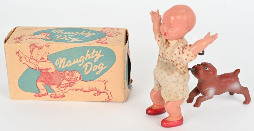 JAPAN CELLULOID WINDUP NAUGHTY DOG w/ BOX: All original in great shape. Windup works. Boxed 6" Excellent