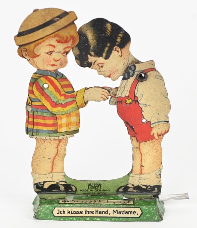 GERMAN TIN BOY KISSING GIRLS HAND SQUEEZE TOY: All original with nice colors. Works. 5" Excellent