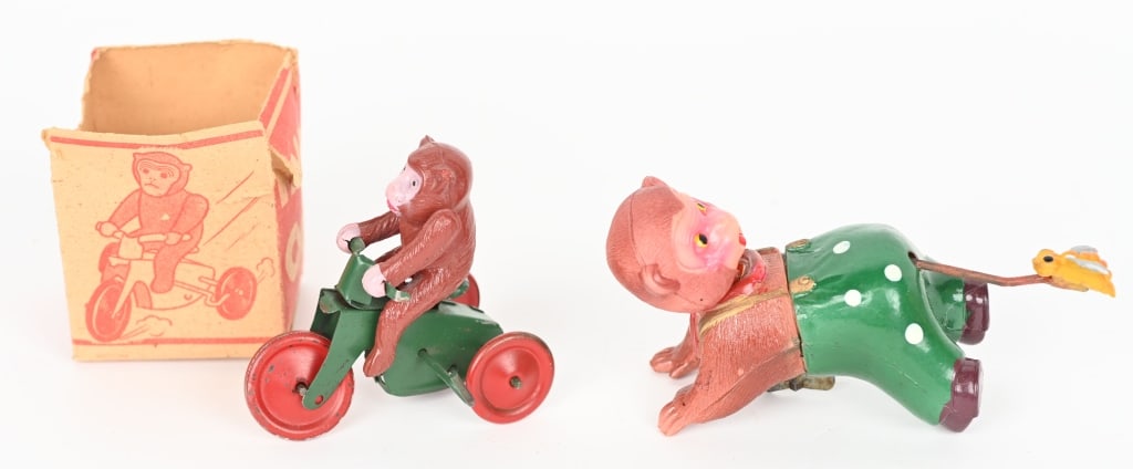 2- JAPAN CELLULOID WINDUP MONKEY TOYS: Includes Monkey on Trike in Box and Monkey with Bee on Butt. Both all original in great shape. Both work. Largest 4 1/2" Excellent