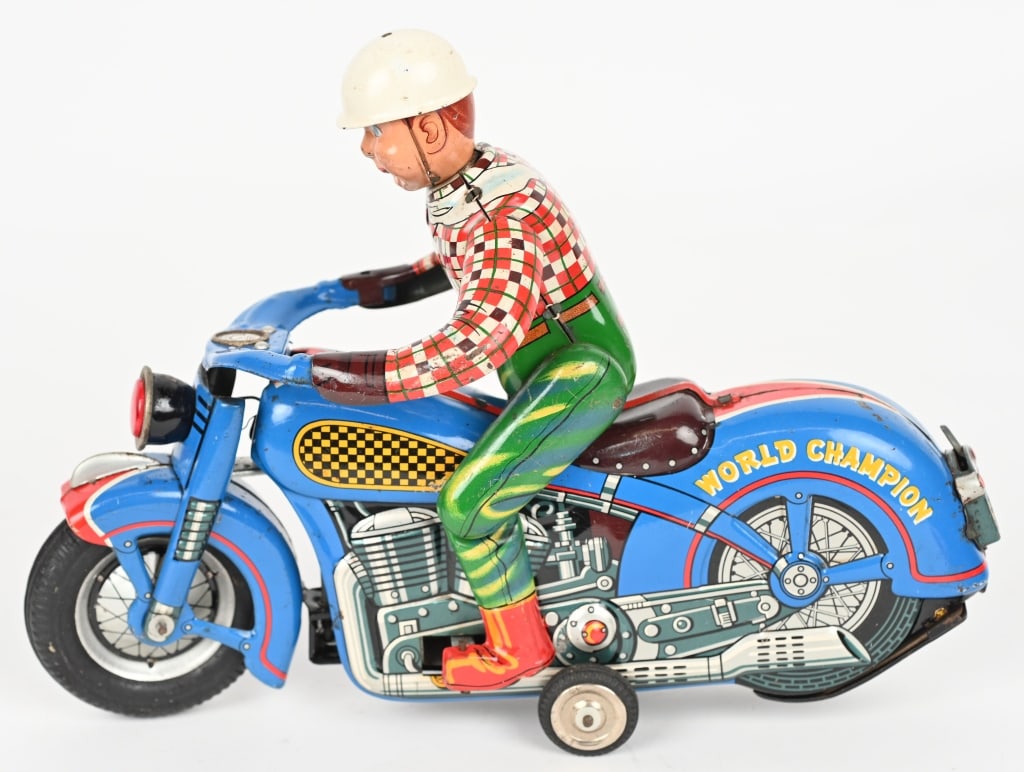 JAPAN BATTERY OP WORLD CHAMPION MOTORCYCLE: All original and complete. Has Howdy Doody Driver. Large motorcycle with nice colors. Worked when tested. 11" Excellent