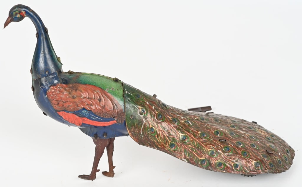 EBO PAO PAO TIN WINDUP PEACOCK: All original with great colors. Windup works. Head feather missing. 11" Excellent