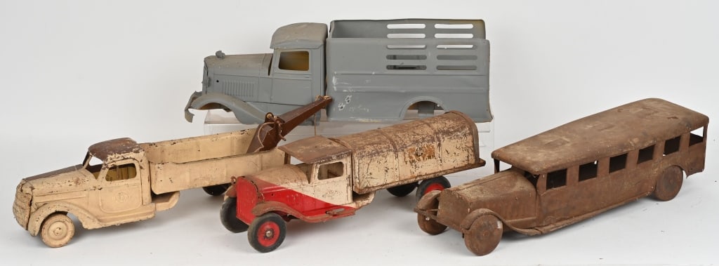 4- PRESSED STEEL TRUCKS FOR RESTORATION: Includes Buddy L Milk Truck, Steelcraft Bus, Buddy L Stake Truck, and Buddy L Tow Truck. All for restoration. AS-IS