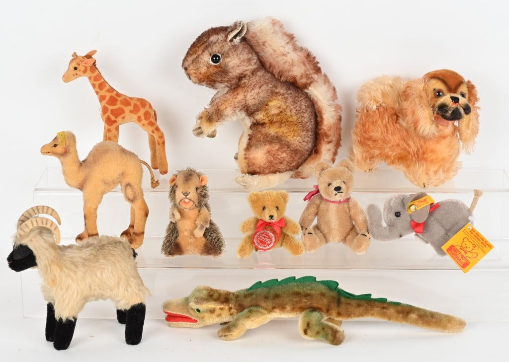 LOT OF VINTAGE STEIFF ANIMALS: Includes Camel, Alligator, Dog, Ram, Squirrel, Giraffe, Elephant, Beaver,and 2 Bears. Some with earlier buttons. Largest 8" Excellent