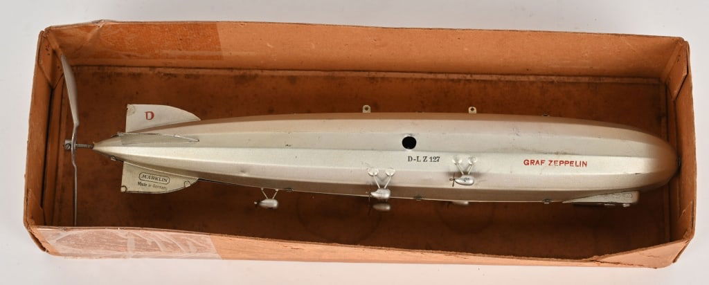 MARKLIN CLOCKWORK GRAF ZEPPELIN D-LZ 127: German tin clockwork Zeppelin D-LZ 127. All original and complete. Looks basically never played with condition. Windup works. Comes with original Box bottom. 16" Excellent