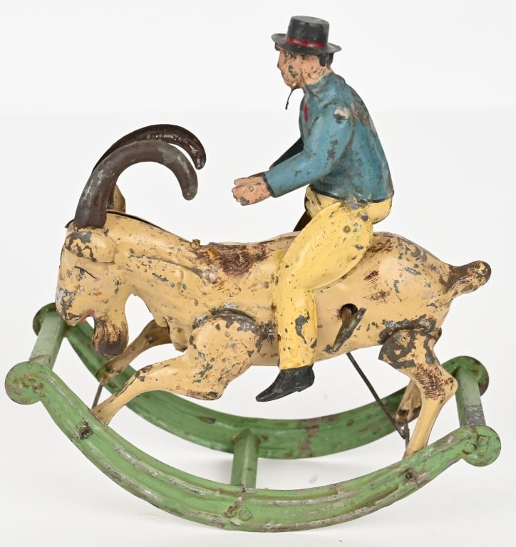 GERMAN HAND PAINTED TIN MAN RIDING GOAT: German hand painted tin windup Man Riding Goat. Nice original condition. Has some normal loss. Windup works. 7 3/4" Very Good-Excellent