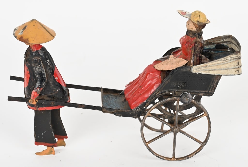 FERNAND MARTIN LE POUSSE-POPUSEE: Ferdnand Martin Chinaman Pulling Rickshaw. Has flywheel mech. All original and complete. A very early toy. 8" Excellent