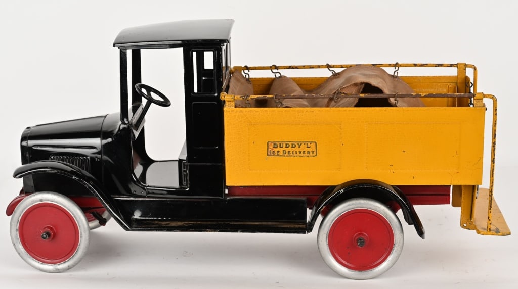 BUDDY L ICE DELIVERY TRUCK: Buddy L pressed steel Ice Delivery Truck. All original with wonderful paint. Decals are original but faded. Still has original canvas cover on bed. Comes with replacement Ice Cube and Tongs. Bed of tr