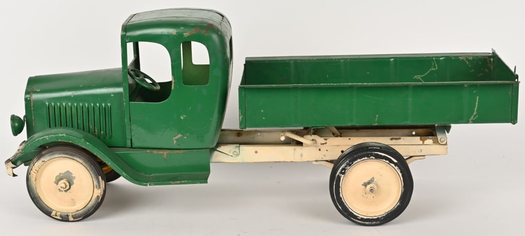 HOENES VIKING CONSTRUCTION DUMP TRUCK: Hoenes Engineering pressed steel Viking Construction Dump Truck. A very RARE toy truck made in Cleveland, Ohio. An original truck that us all complete with headlights, bumper, and tailgate. The truck 