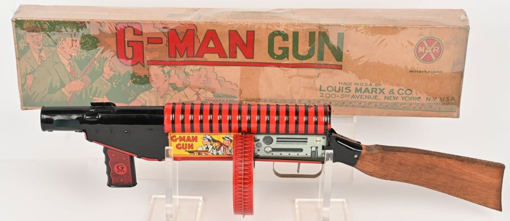 MARX TIN WINDUP G-MAN GUN w/ BOX: Marx tin windup G-Man Gun. All original with great colors and graphics. Has original wood stock. Gun works. Boxed 24" Excellent