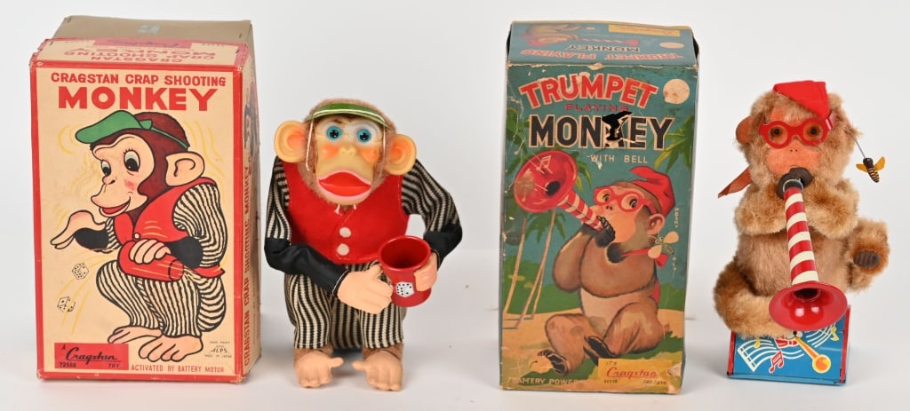 TRUMPET PLAYING MONKEY & CRAP SHOOTING MONKEY: Japan battery operated Trumpet Playing Monkey and Crap Shooting Monkey. Both all original in nice condition. Both worked when tested. Both with Boxes. Largest 10" Excellent