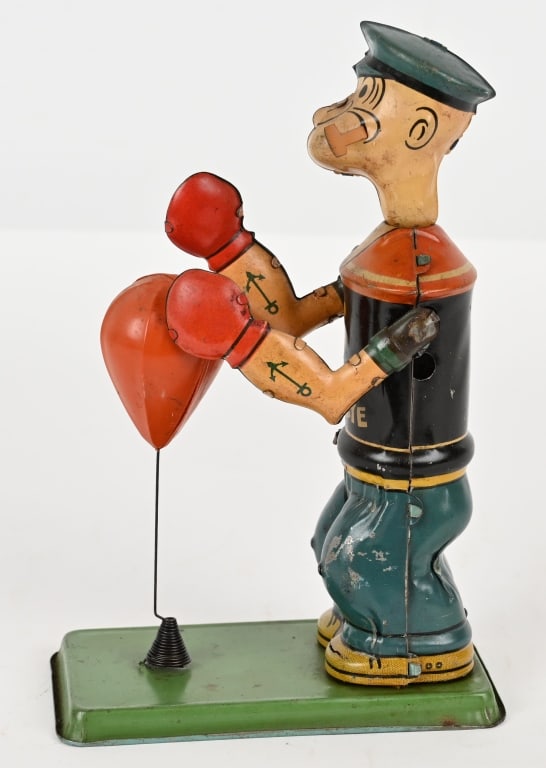 CHEIN TIN WINDUP POPEYE FLOOR PUNCHER: Chein tin windup Popeye Floor Puncher. All original and complete. Windup works. 7 1/2" Very Good-Excellent