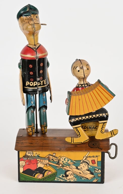 MARX TIN WINDUP POPEYE & OLIVE OYL JIGGERS: Marx tin windup Popeye and Olive Oyl Jiggers. All original and complete including arms. Toy has great graphics. Windup works. 9 1/2" Excellent