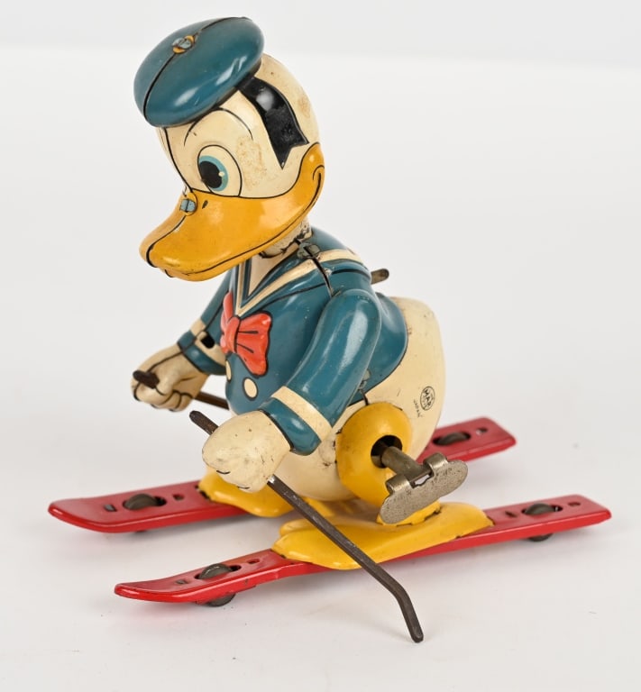 LINEMAR TIN WINDUP DONALD DUCK SKIER: Scarce Linemar tin windup Donald Duck Skier. All original with great colors and gloss. Windup works. 6" Excellent