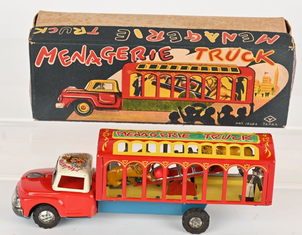 JAPAN TIN FRICTION MENAGERIE TRUCK w/ BOX: Japan tin friction Menagerie Truck. All original with great colors. Has 2 Lions and Tamer in back of truck. Looks never played with condition. Friction works. Boxed 10" Excellent