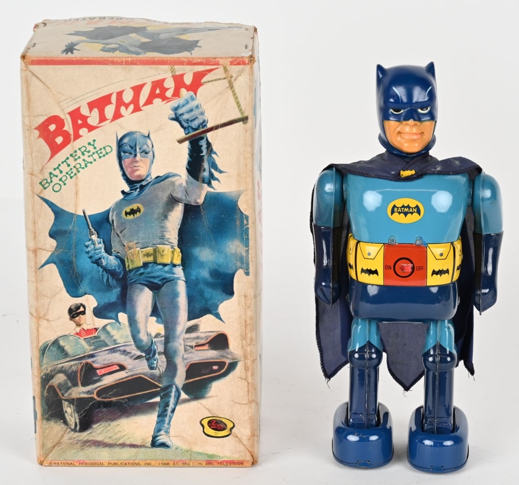 TN BATTERY OP WALKING BATMAN w/ BOX: Nomura battery operated Walking Batman. Made in Japan. All original and complete. A super clean example that looks never played with condition. Still has original Batman cape. Battery box is super cle