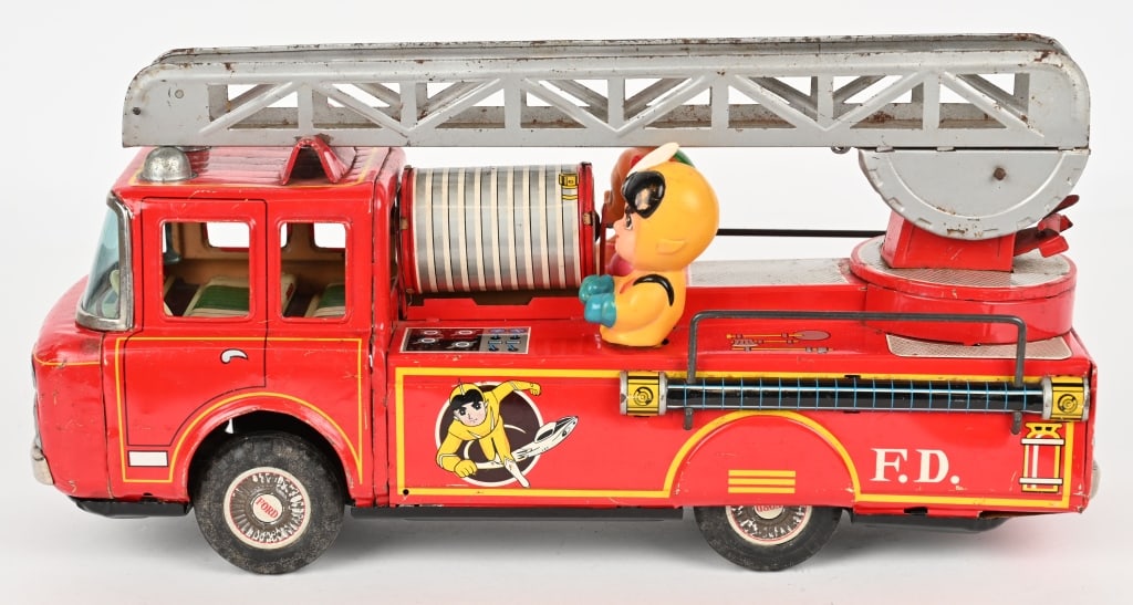 YONEZAWA TIN FRICTION SUPER GETTER FIRE TRUCK: Japan tin friction Super Getter Fire Truck. All original with nice colors and graphics. Has both vinyl figures still sitting on truck. Friction works. Missing extension ladder. 14" Excellent