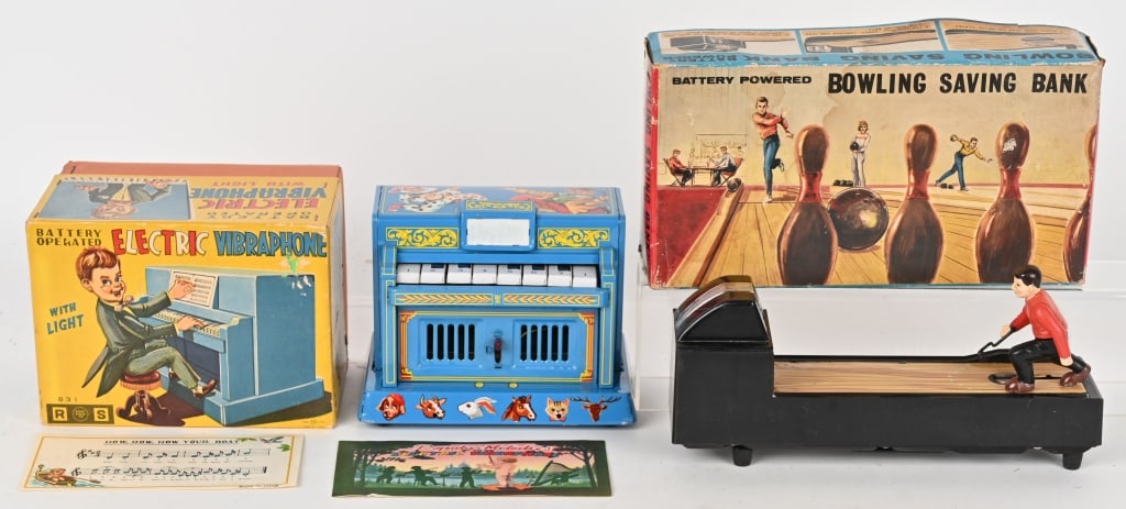 ELECTRIC VIBRAPHONE & BOWLING SAVING BANK: Japan battery operated Electric Vibraphone and Bowling Saving Bank. Both all original in nice condition. Both worked when tested. Both with Boxes. Largest 12" Excellent