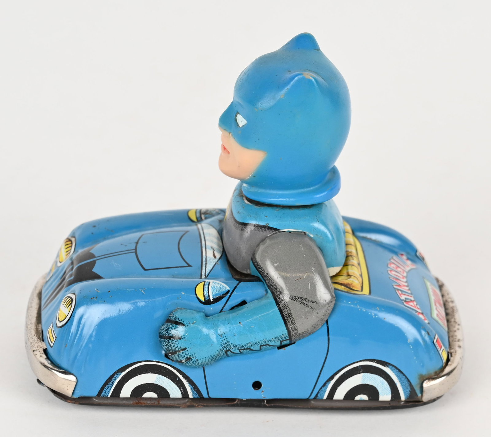 MARX TIN FRICTION BATMAN BATMOBILE: Marx tin friction Batman Batmobile. All original tin car with vinyl Batman Driver. Has nice colors and graphics. Friction works. Minor rub on bottom. Hard to find toy. 4" Excellent