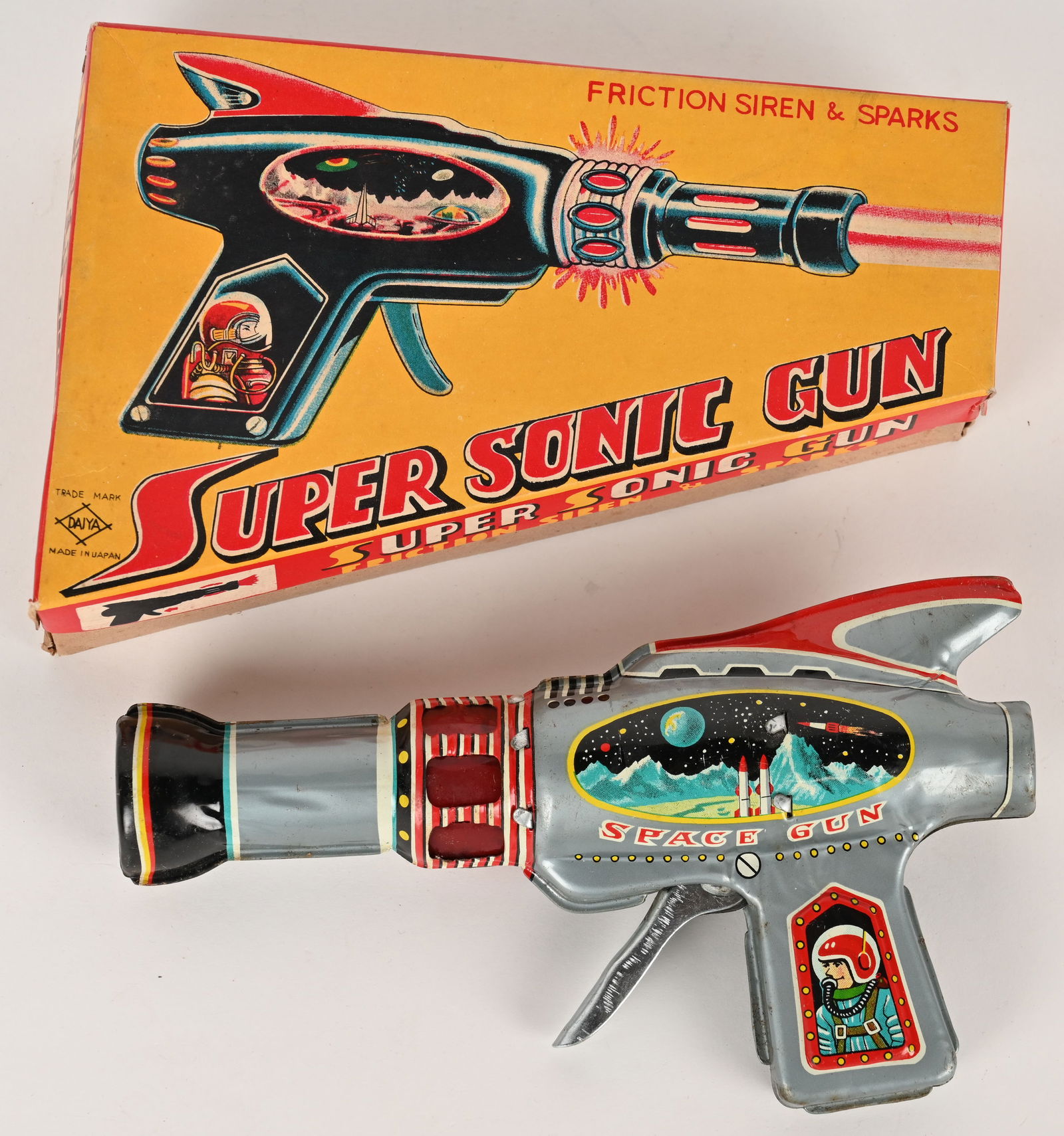DAIYA TIN FRICTION SUPER SONIC GUN w/ BOX: Japan tin friction Super Sonic Gun with Siren and Spark. All original in great shape. Has very nice Space graphics. Worked when tested. Comes with crisp Box. 7 1/2" Excellent