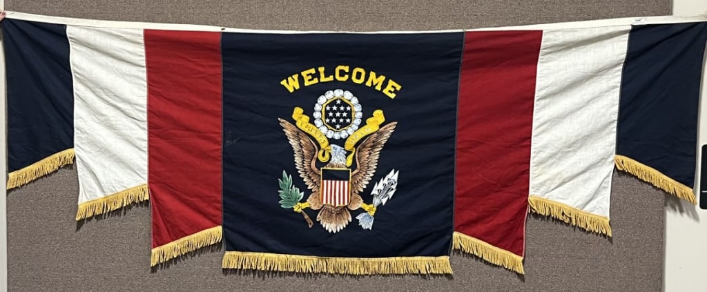 WWII PATRIOTIC WELCOME HOME BANNER W EAGLE WW2: WWII Period Patriotic Banner that is multi sectional being made of Red, White and Blue with the center section having printed a Federal Eagle perched on a shield with "WELCOME" obviously a welcome hom