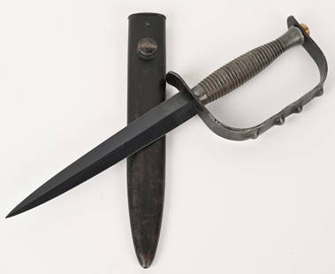WW2 BRITISH SYKES FAIRBAIRN KNUCKLE FIGHTING KNIFE: World War II era Fairbairn Sykes commando fighting knuckle knife. Blade is blued finish, near 100% with light wear. Ribbed handle shows some wear and is solid. Knuckleguard is tight. The scabbard is i