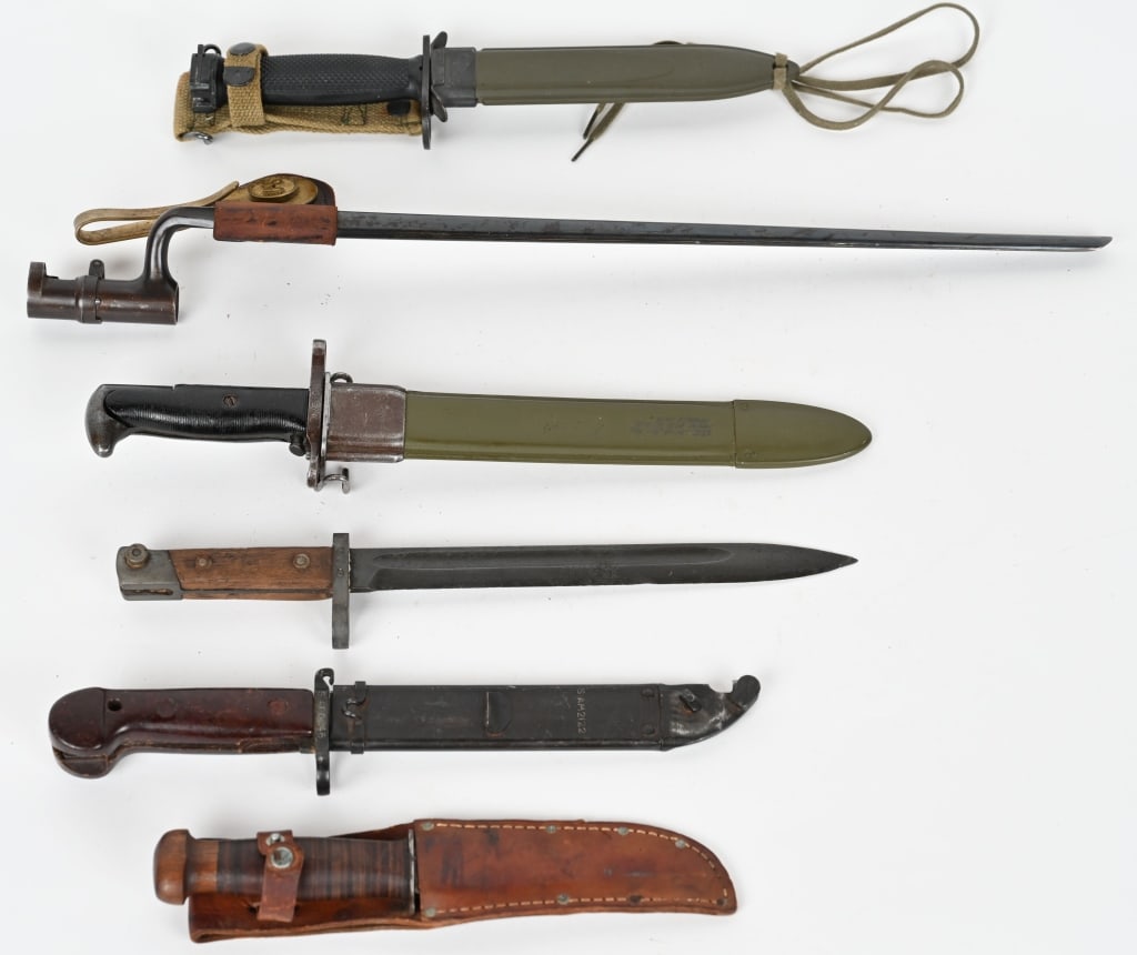 INDIAN WARS WWII VIETNAM EDGED WEAPON LOT WW2: Lot of edged weapons to include 1) US MODEL 1873 BAYONET FOR THE TRAPDOOR SPRINGFIELD. A blued, 46cm (18") long, tapering triangular blade with fullers to all three sides with the blade mark