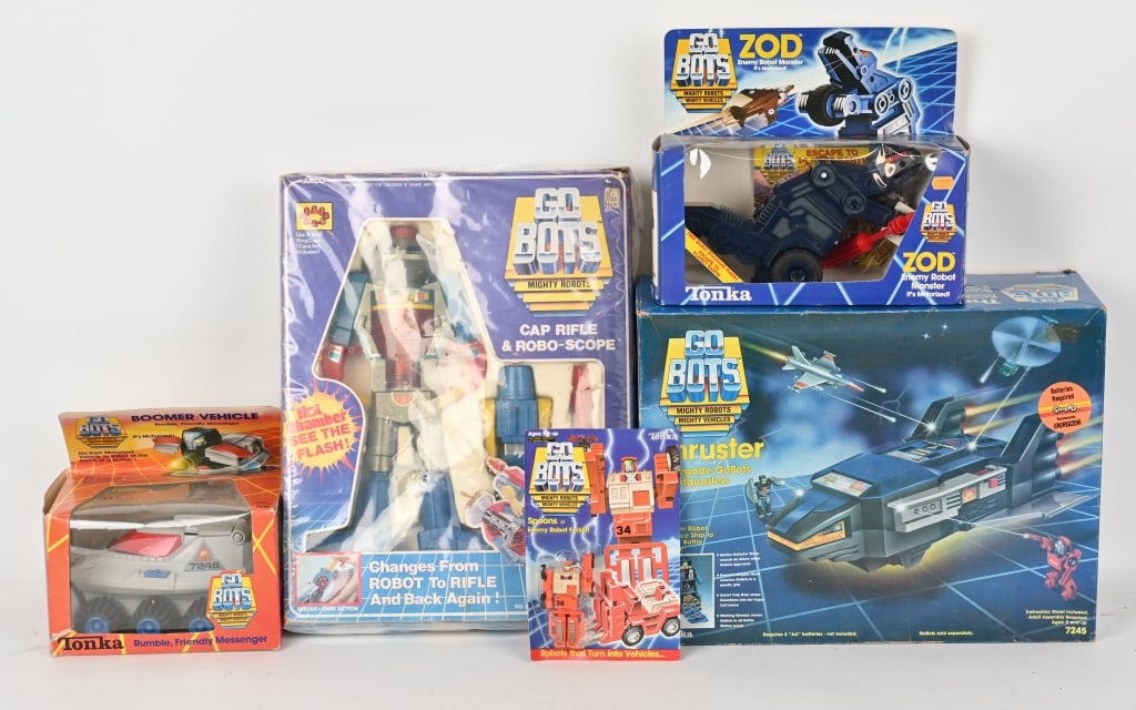 TONKA GO-BOTS LOT w/ BOXES: Includes Thruster, Hot Chamber Cap Rifle & Robo Scope, Zod, Sppons Forklift, and Boomer Vehicle. All great condition and Boxed. Largest 18" Excellent