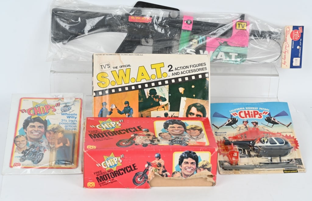 CHIPS & SWAT LOT: Includes Mego Chips Motorcycle in Box, Chips Helicopter on Card, Chips Wheels Willy Action Figure on Card, SWAT Action Figure Set in Box, and Swat Rifle in package. All in great shape,