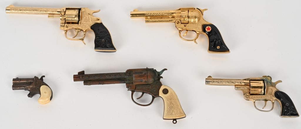 5- COWBOY CAP GUNS: includes Hide-Away Derringer, Texan Jr, Eagle, Pont Boy, and Grizzly. All in nice original condition. Largest 10 1/2" AS-IS