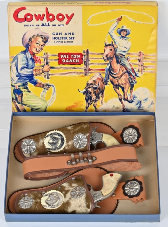 BUFFALO BILL CAST IRON CAP GUNS, HOLSTER w/ BOX: Great Cowboy set include 2 nickel plated cast iron Buffalo Bill cap pistols, and leather double holsters with the colorful original box. The set looks unused, and the cap guns have not been fired. The