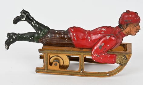 GERMAN HESS TIN FLYWHEEL BOY ON SLED