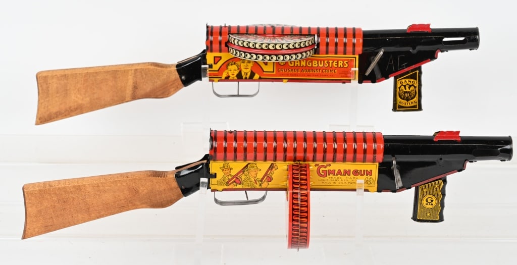 2- MARX TIN WINDUP GANG BUSTER & G-MAN GUNS: Both all original working. Nice condition. 23" Excellent