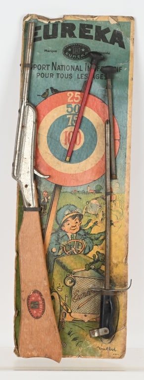 ANTIQUE FRENCH EUREKA TOY RIFLE SET ON CARD: Early Eureka set includes rifle, 2 darts and bayonet. All mounted on an graphic original card. 19" by 6 1/2", Very Good-Excellent