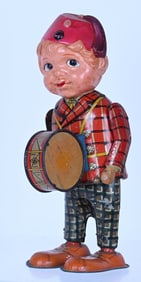 JAPAN TIN & CELLULOID WINDUP DRUMMER BOY