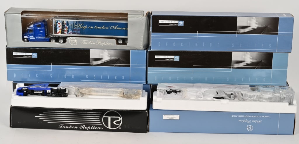 8- TONKIN REPLICAS 1:53 SEMI TRUCKS MIB: Lot of 8 Tonkin Replicas 1:53 scale Semi Trucks. Includes Freightliner Columbia Class with 48" Van, Kenworth W900L Bradley With Lowboy, Volvo 770 with 48" Van Trailer, Volvo VNL 780 with 53" Dry Van,