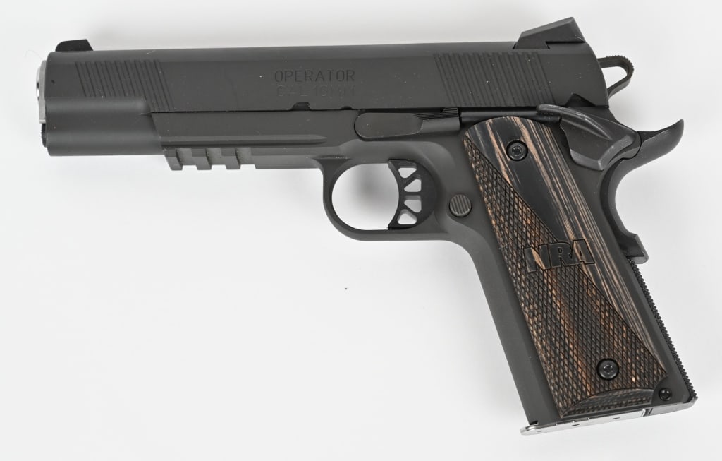 SPRINGFIELD ARMORY OPERATOR NRA EDITION 10MM: SERIAL NUMBER: NM698159. BARREL: 5". CALIBER: 10MM. This is a NRA limited edition Springfield Operator semi automatic pistol. It features NRA edition laser engraved checkered grips, three with dot fac