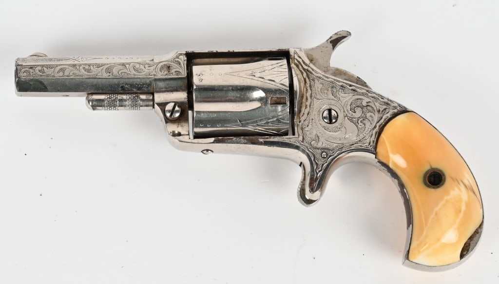 ENGRAVED HOOD FIREARMS CENTENNIAL 1876 REVOLVER: SERIAL NUMBER: NSN. BARREL: 2 1/8". CALIBER: .32. MANUFACTURED: 1996. Centennial 1876 marked .32 cal. rimfire revolver with barrel address also marked "Hood Fa Co Pat. Apr. 6. 1875". This example has