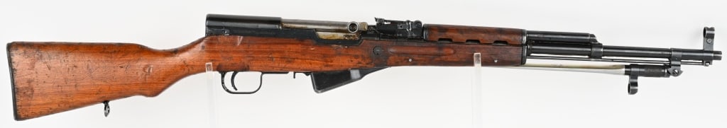 NORINCO SKS SEMI AUTO 7.62X39 CARBINE: SERIAL NUMBER: SKS33477 BARREL: 20 1/4" CALIBER: 7.62X39. MANUFACTURED: 1950-1990 CHINA , IMPORT MARKED from PW Arms. Metal is blue finish with hooded front sight with 1000 meter rear sight. Spiked ba