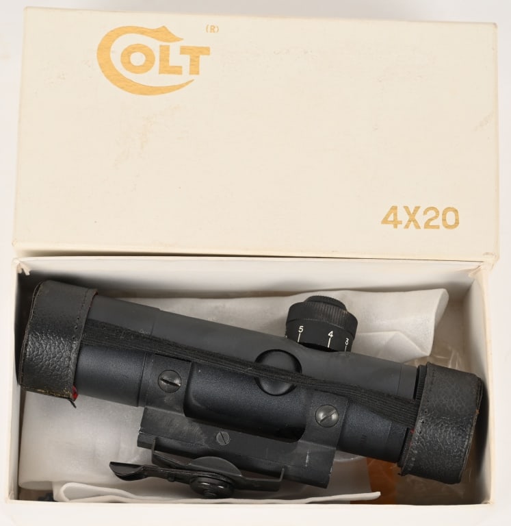 BOXED COLT AR 4X20 CARRY HANDLE SCOPE: Rifle scope for Colt AR model rifles meant to be mounted on the carry handle. Comes with original white Colt box and leather lens covers. Made in Japan. CONDIITON: Appears never to have been used. Exc