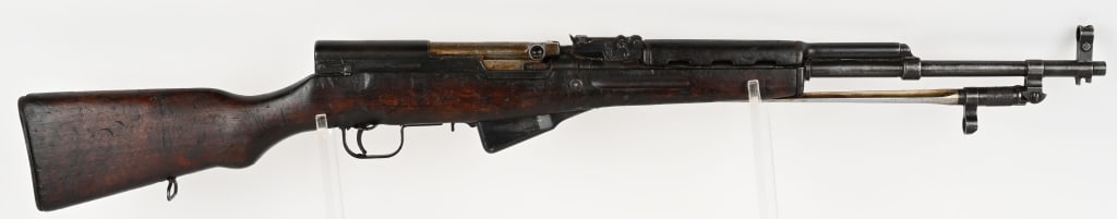 NORINCO SKS SEMI AUTO 7.62X39 CARBINE: SERIAL NUMBER: SKS33478 BARREL: 20 1/4" CALIBER: 7.62X39. MANUFACTURED: 1950-1990 CHINA , IMPORT MARKED from PW Arms. Metal is blue finish with hooded front sight with 1000 meter rear sight. Spiked ba