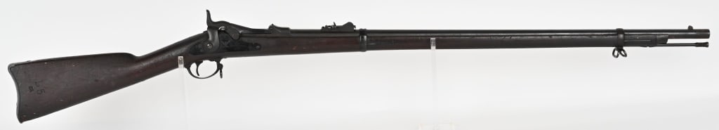 US MODEL 1873 TRAPDOOR SPRINGFIELD RIFLE, N.J.: SERIAL NUMBER: 31504. BARREL: 32 5/8". CALIBER: 45-70. Receiver is marked N.J. for New Jersey and "2 over H". It features two barrel bands, nose cap, cleaning rod, and standard 1873 rear sight. Lock i