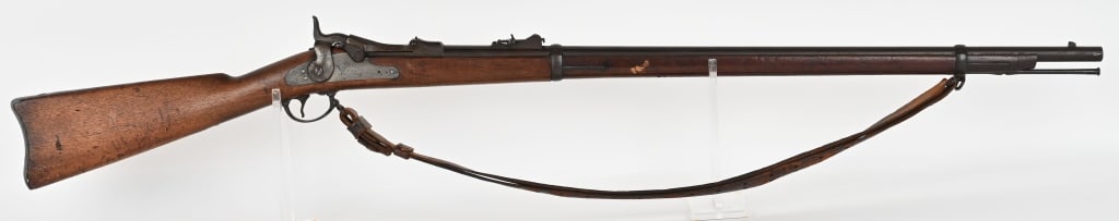 US MODEL 1873 TRAPDOOR SPRINGFIELD RIFLE: SERIAL NUMBER: 250251. BARREL: 32 5/8". CALIBER: 45-70. It features two barrel bands, nose cap, cleaning rod, leather sling, and standard 1873 rear sight. Lock is marked "US SPRINGFIELD" with eagle in